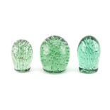 Property of a lady - a group of three Victorian glass dump paperweights, with 'aqua' bubble