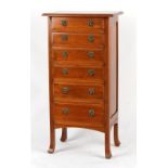 Property of a lady - an early 20th century Colonial teak narrow chest of six graduated drawers, with