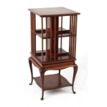 Property of a lady - an early 20th century mahogany revolving bookcase, with cabriole legs, the