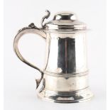 Property of a lady - a good George III silver lidded tankard, with acanthus decoration to thumb-