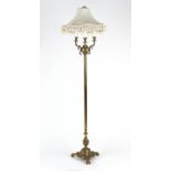 Property of a gentleman - a brass triple light standard lamp, with trefoil base.