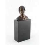 Property of a gentleman - a bronze bust of a gentleman, on black stone base, 9.75ins. (24.8cms.)