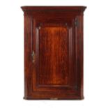 Property of a gentleman - a late 18th century George III oak & mahogany corner wall cabinet, the