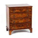 Property of a lady - a small figured walnut & featherbanded chest of four long graduated drawers