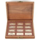 Property of a deceased estate - a cased set of twelve sterling silver ingots depicting Royal