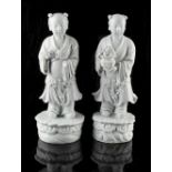 Property of a lady - a pair of Chinese blanc de chine figures of standing boys, 19th century, loss