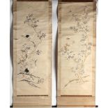 A pair of early 20th century Chinese embroidered silk scrolls depicting red crowned cranes and