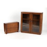 Property of a deceased estate - an Ercol elm glazed two-door cabinet enclosing two glass shelves,