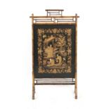 A late 19th / early 20th century bamboo screen, the Chinese silk panel worked in couched gold