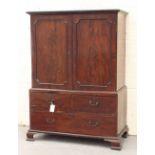 Property of a lady - a George III mahogany two-part linen press, on ogee bracket feet, 52.35ins. (