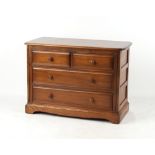 Property of a deceased estate - an Ercol elm chest of two short & two long drawers, 40.2ins. (