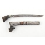 Property of a deceased estate - a 19th century Malay sewar dagger or tumbok lada, with carved horn