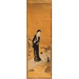 An early 20th century Japanese scroll painting on silk depicting a bijin standing on a bridge,