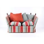 Property of a lady - a modern knole sofa with striped upholstery, 60ins. (152cms.) long.
