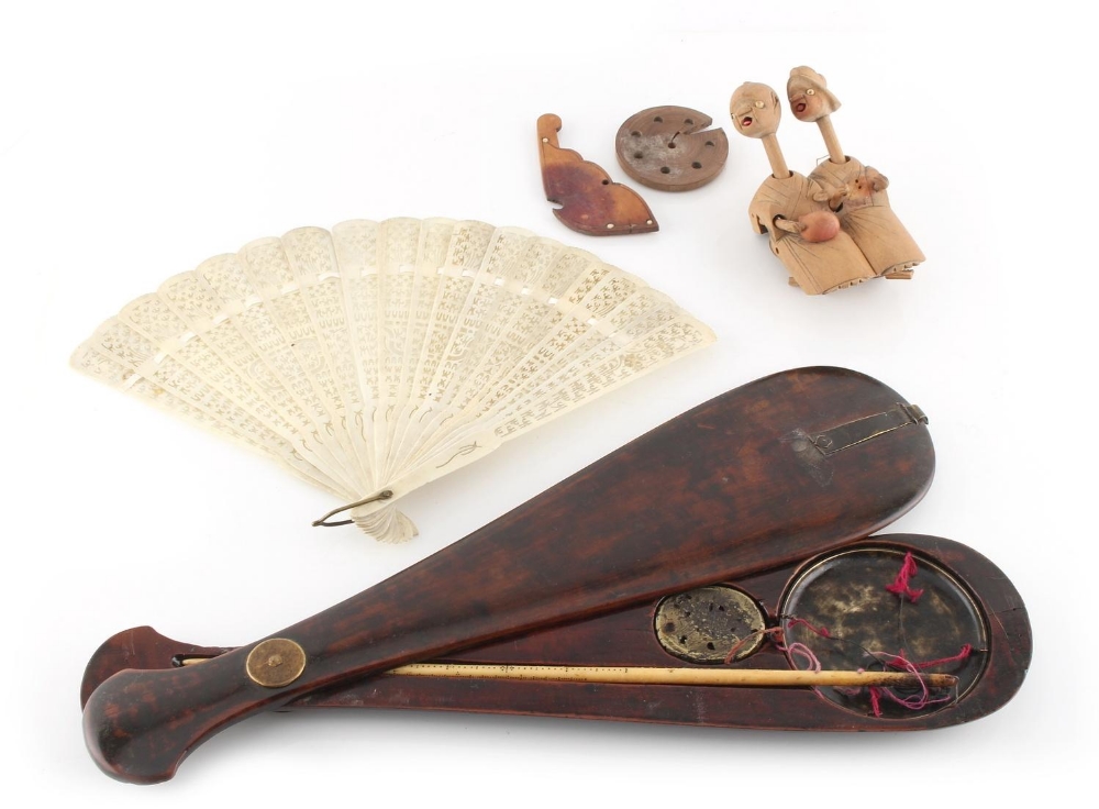 A set of opium scales, in wooden paddle shaped case; together with a bone fan; and a Kobe toy (3).