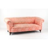 Property of a gentleman - a small late Victorian walnut & pink floral upholstered chesterfield sofa,