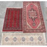 Property of a lady of title - three assorted rugs including a hand woven Turkoman design rug,