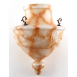 Property of a gentleman - an early 20th century white & amber glass faux marble ceiling light