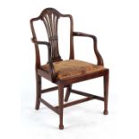 Property of a lady - a late 19th century Hepplewhite style carved mahogany elbow chair with
