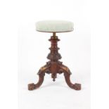 Property of a deceased estate - a Victorian carved walnut adjustable piano stool, with tripod base.