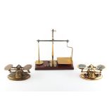 Property of a lady - a set of brass & agate postal scales, complete with a graduated set of four