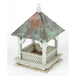 Property of a deceased estate - a painted wooden bird house, with weathered copper clad roof.