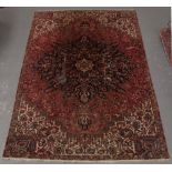 Property of a deceased estate - a Persian Heriz carpet, old moth damage, 138 by 94ins. (350 by