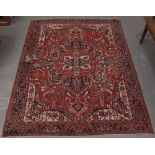 Property of a deceased estate - a Persian Heriz carpet, old moth damage, 150 by 114ins. (381 by