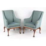 Property of a lady - a pair of George II style carved walnut & upholstered armchairs, the cabriole