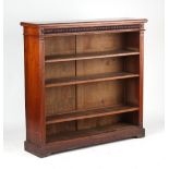 Property of a deceased estate - a late Victorian walnut open bookcase with reel moulded frieze above