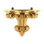 Property of a lady - a 19th century carved giltwood wall bracket, 10ins. (25.5cms.) high, 14ins. (
