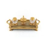 Property of a deceased estate - a 19th century ormolu inkstand, with two inkwells, on paw feet,