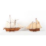 Property of a lady - two wooden model sailing ships, the larger 28ins. (71cms.) long (overall) (2).
