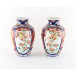 Property of a lady - a pair of Japanese Imari vases, each 8.35ins. (21.2cms.) high (2).