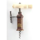 Property of a gentleman - a mid 19th century Thomason type corkscrew, with bone handle & bristle