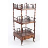 An early 19th century Regency period rosewood three tier whatnot, with spindle galleries & drawer