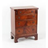 Property of a deceased estate - a small Bevan Funnell Reprodux mahogany bachelor chest, 23.25ins. (