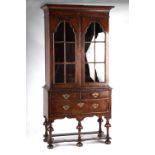 Property of a deceased estate - a walnut glazed two-door cabinet on stand, parts 18th century, the