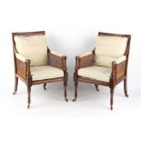 Property of a deceased estate - a pair of 19th century mahogany & cane panelled bergere armchairs,