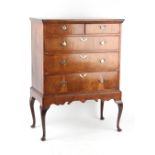 Property of a gentleman - an early 18th century walnut chest on stand, the base contemporary but