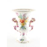 Property of a gentleman - a 19th century porcelain two handled vase painted with bouquets &