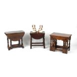 Property of a deceased estate - a nest of three oak occasional tables; together with two oak drop-