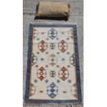 Property of a deceased estate - a Walton & Co. wool rug, 58 by 36ins. (146 by 90cms.); together with