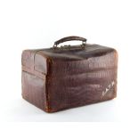 Property of a lady - an early 20th century crocodile skin vanity case, by John Pound & Co. 378