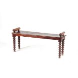 Property of a gentleman - a 19th century mahogany window seat, with tapering bobbin turned supports,