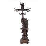 Property of a deceased estate - a 19th century Black Forest carved bear hat & stick stand,