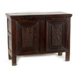 Property of a lady - an 18th century French or Flemish carved oak two-door cupboard, with dentil