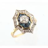 An 18ct yellow gold sapphire & diamond cluster ring with concave sided octagonal setting, the centre