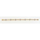 An attractive 18ct yellow gold sapphire & diamond link bracelet, the seven oval cushion cut