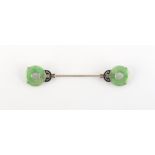 Property of a lady - an Art Deco jadeite black enamel & diamond jabot pin, in white metal setting,